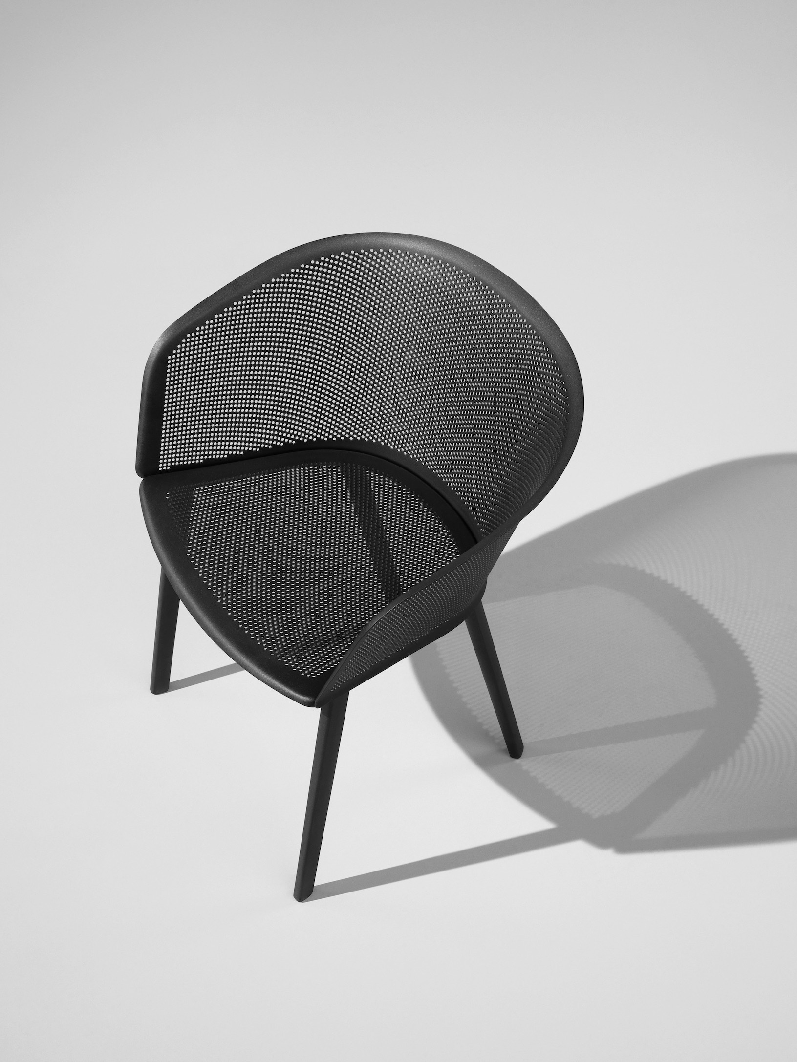 KETTAL STAMPA chair, the perforated metal shell