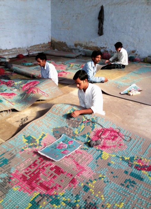 Indian craft workers weaving a CANEVAS carpet